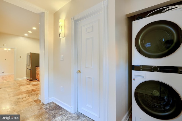 washroom with stacked washer and clothes dryer