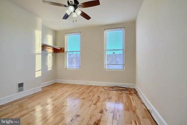 spare room featuring ceiling fan and light hardwood / wood-style flooring