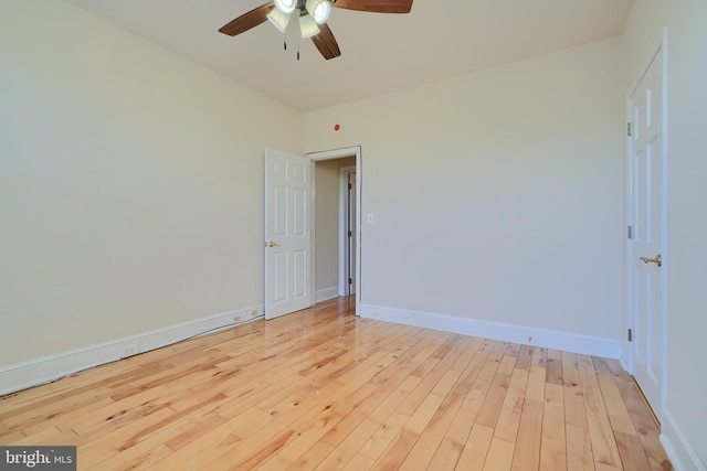 unfurnished room with ceiling fan and light hardwood / wood-style flooring