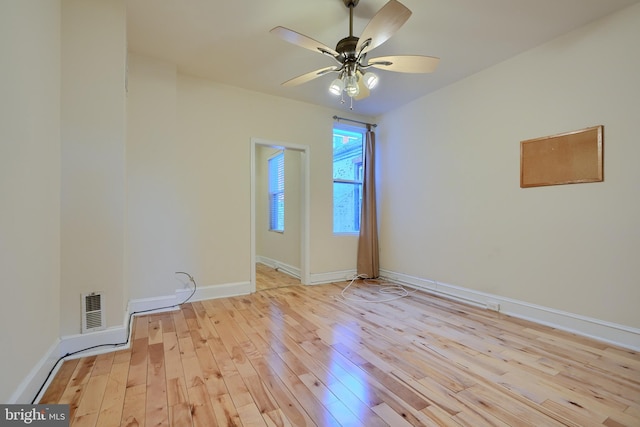 spare room featuring ceiling fan and light hardwood / wood-style flooring