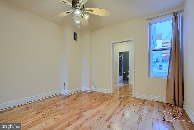 unfurnished room featuring ceiling fan and light hardwood / wood-style flooring