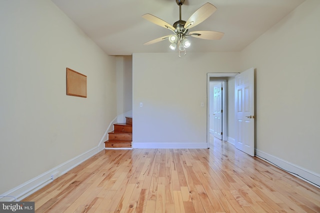 spare room with light hardwood / wood-style floors and ceiling fan