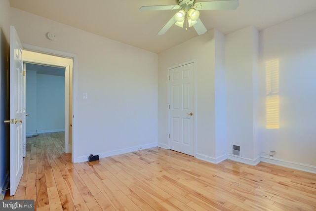 spare room with ceiling fan and light hardwood / wood-style floors