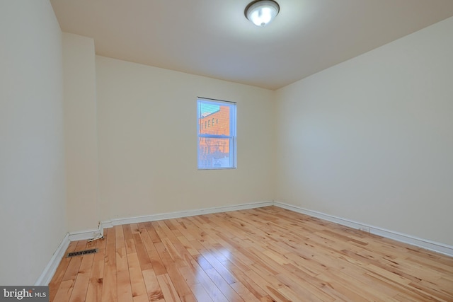 unfurnished room featuring light hardwood / wood-style flooring