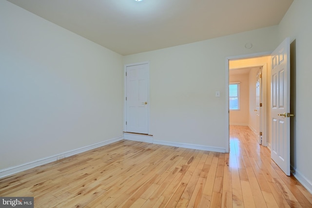 unfurnished room featuring light hardwood / wood-style floors