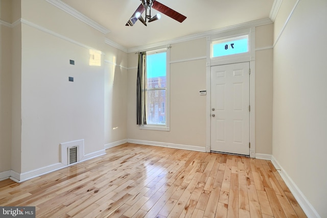 entryway with ceiling fan, ornamental molding, and light hardwood / wood-style flooring