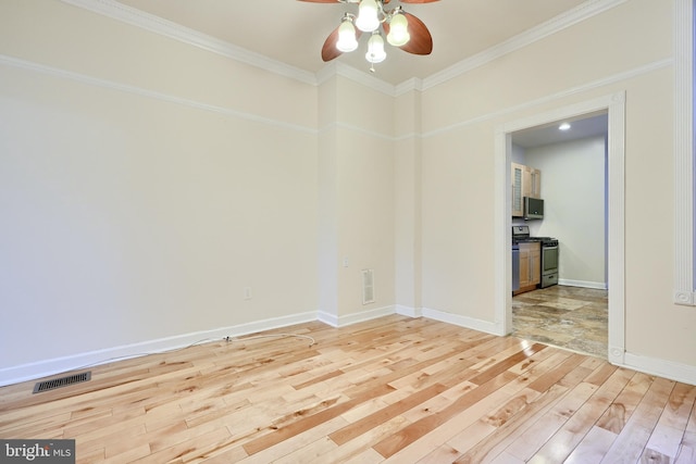 spare room with ornamental molding, ceiling fan, and light wood-type flooring