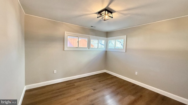 empty room featuring wood-type flooring