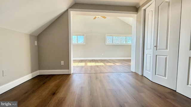 bonus room with lofted ceiling, hardwood / wood-style floors, and ceiling fan