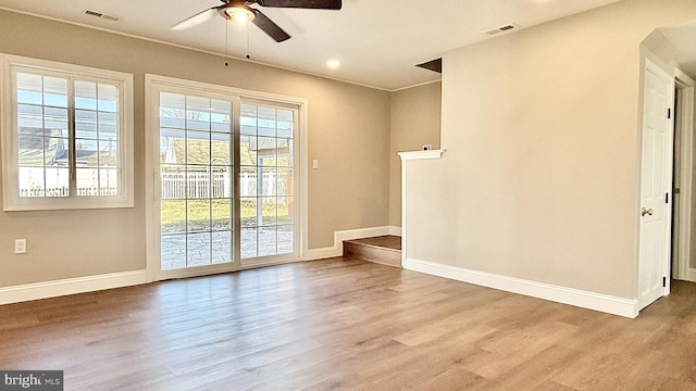 unfurnished room with ceiling fan and light hardwood / wood-style flooring