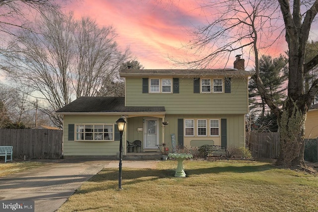 view of front of home with a lawn