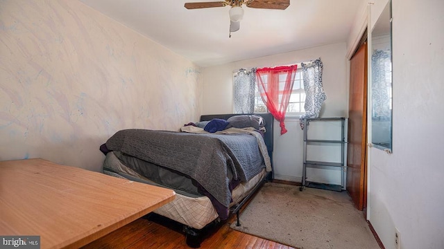 bedroom with ceiling fan and hardwood / wood-style floors