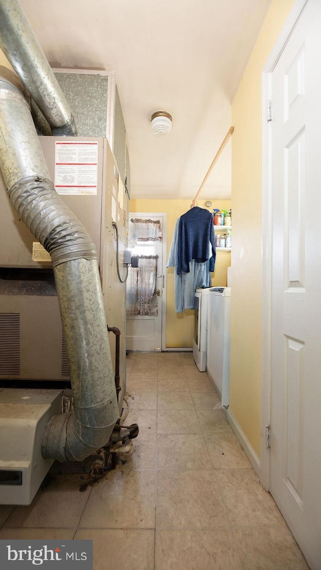 interior space with heating unit and light tile patterned floors