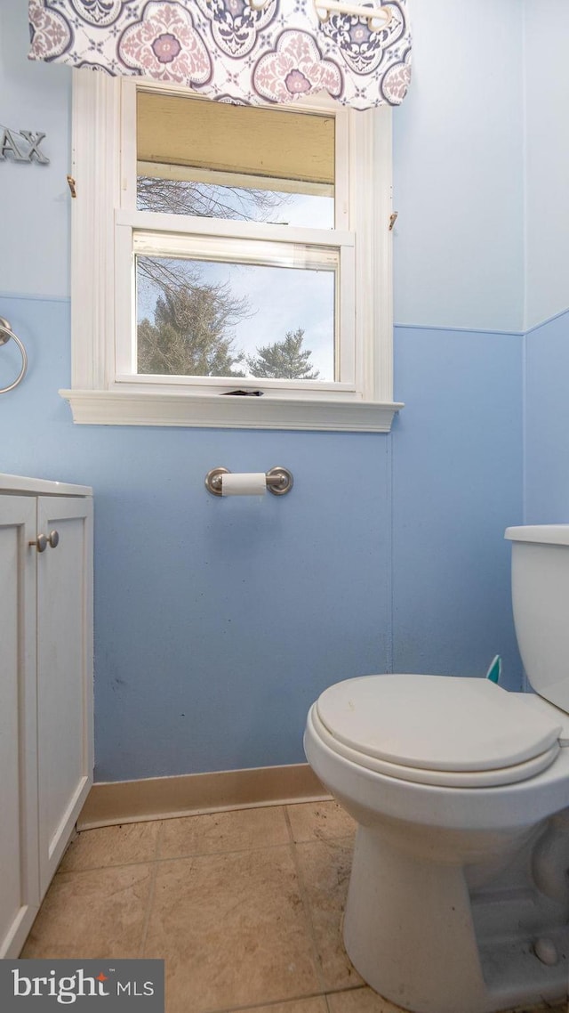 bathroom featuring toilet and tile patterned floors