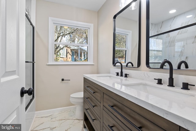 bathroom with toilet, a shower with door, and vanity