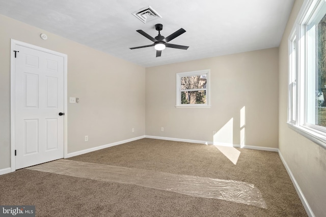 carpeted empty room with ceiling fan