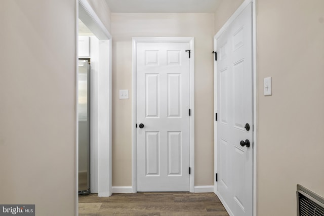 hallway featuring hardwood / wood-style floors