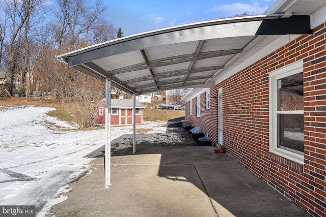 view of snow covered parking