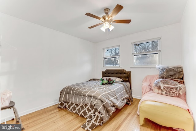 bedroom featuring ceiling fan and hardwood / wood-style floors