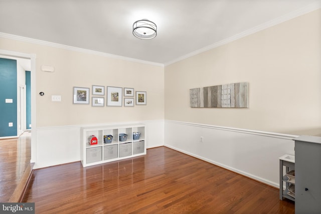 interior space with dark wood-type flooring and crown molding