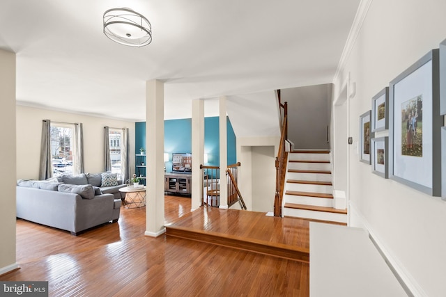 living room featuring hardwood / wood-style floors and ornamental molding