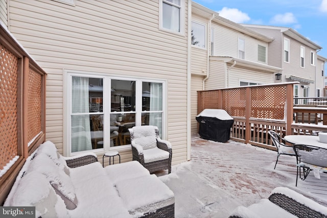 snow covered patio with grilling area