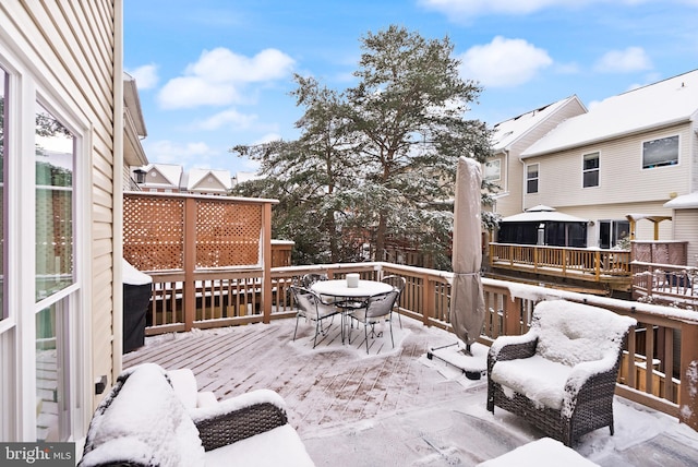 view of snow covered deck