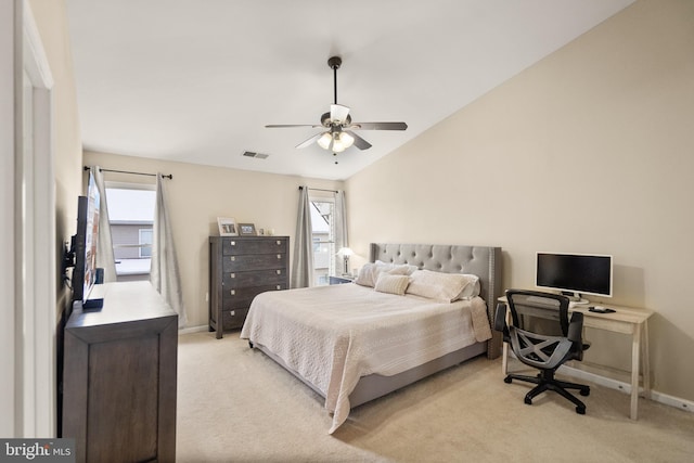 carpeted bedroom featuring ceiling fan, multiple windows, and vaulted ceiling