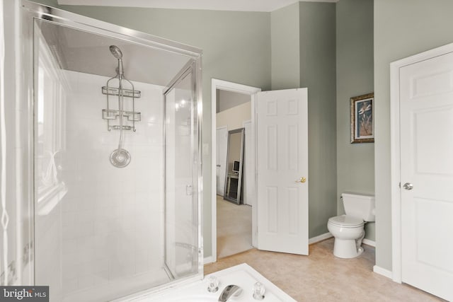 bathroom featuring toilet and walk in shower