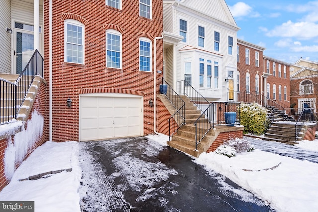 multi unit property featuring a garage