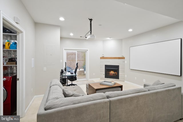 living room featuring light colored carpet and a tile fireplace