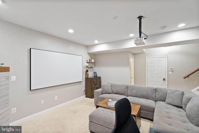 cinema room featuring light colored carpet