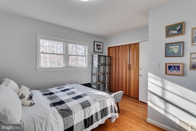 bedroom with light wood-type flooring