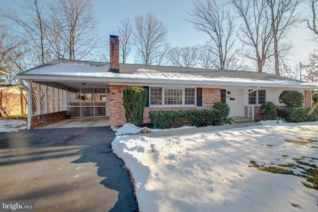 view of front of home featuring a carport