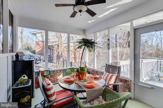 sunroom / solarium with ceiling fan