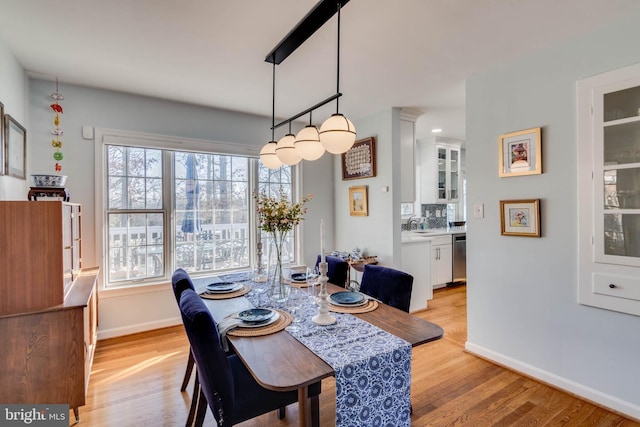 dining room with light hardwood / wood-style floors