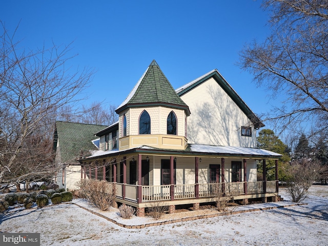 victorian-style house with covered porch