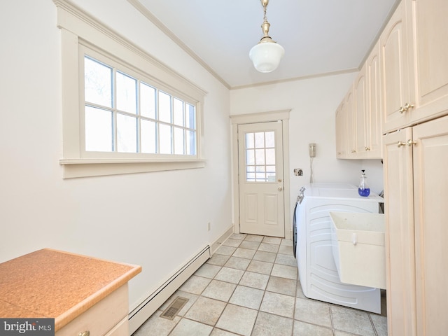 clothes washing area with a baseboard heating unit, independent washer and dryer, crown molding, light tile patterned floors, and cabinets