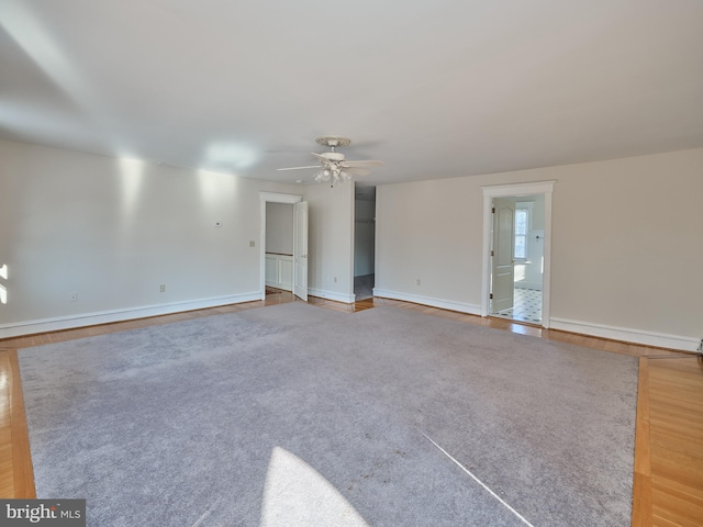 empty room featuring ceiling fan and wood-type flooring