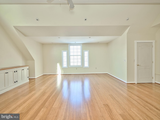 spare room with ceiling fan and light hardwood / wood-style floors