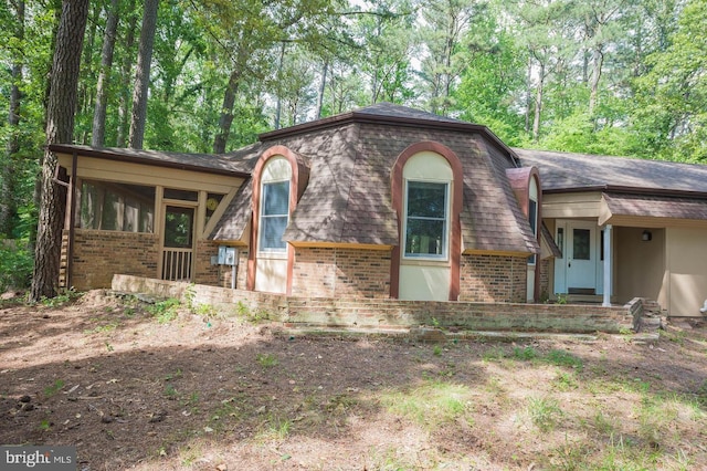 view of front of property featuring a sunroom