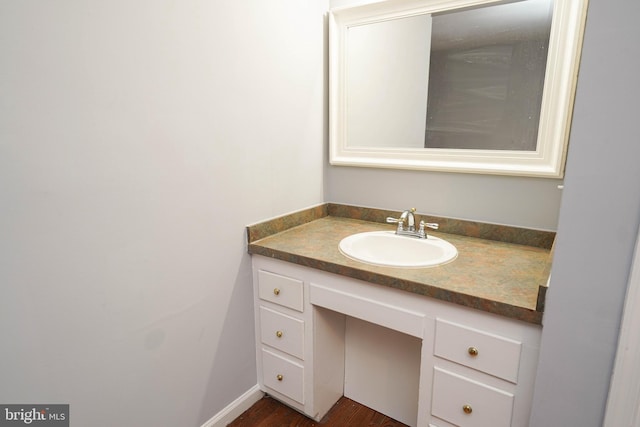 bathroom with vanity and hardwood / wood-style floors