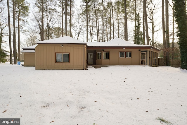 view of snow covered house