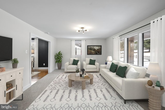 living room with a healthy amount of sunlight and light carpet