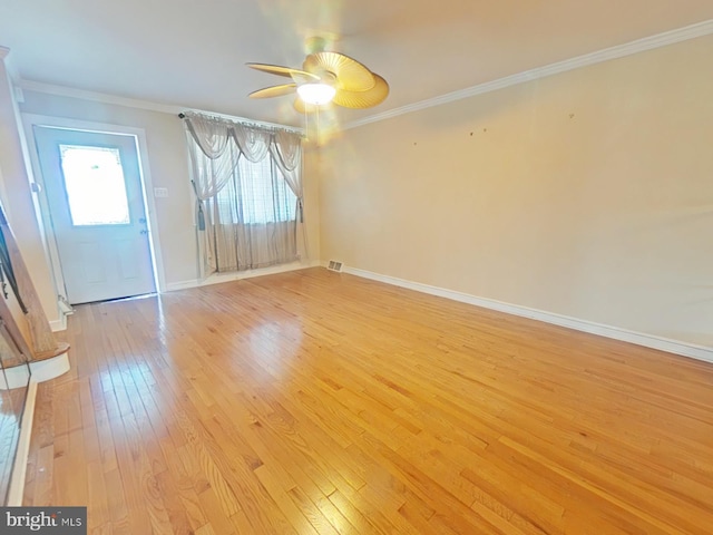 interior space featuring crown molding, light hardwood / wood-style floors, and ceiling fan