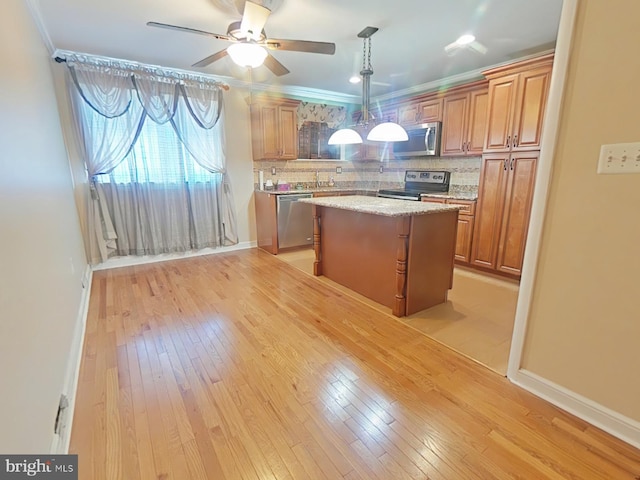 kitchen with tasteful backsplash, light hardwood / wood-style flooring, a kitchen island, pendant lighting, and stainless steel appliances