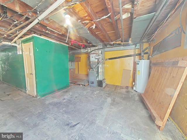 basement with water heater and heating unit