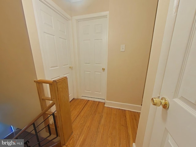 hallway with light hardwood / wood-style flooring