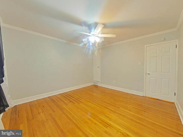 spare room featuring crown molding, ceiling fan, and hardwood / wood-style floors