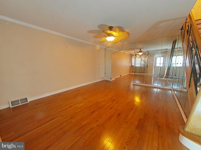 spare room featuring crown molding, ceiling fan, and hardwood / wood-style floors